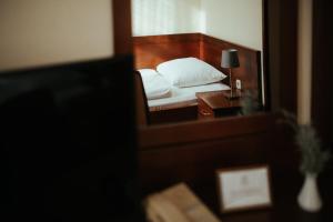 Postel nebo postele na pokoji v ubytování Hotel Central