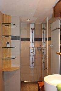 a bathroom with a shower and a sink at Chalet Gädi in Zermatt