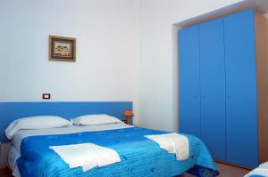 Postel nebo postele na pokoji v ubytování Long Beach Village Residence sul mare spiaggia privata inclusa