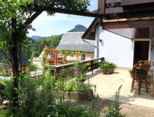 a patio with a view of a house at Pension Elblinge in Prossen