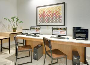 a office with three computers on a desk at Holiday Inn Express Hotel & Suites Dublin by IHG in Dublin +29 photos