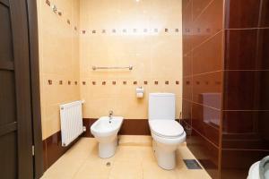 a bathroom with a toilet and a sink at Ай Сафия Hotel in Sudak