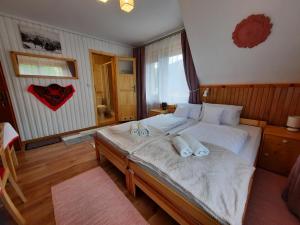 Postel nebo postele na pokoji v ubytování Pokoje Gościnne KAMI