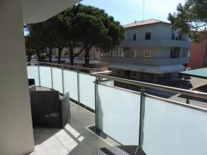 a balcony with a view of the water at Residence Caorle App. n. 5 in Caorle