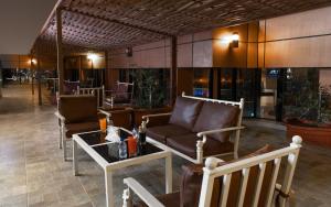 a lobby with chairs and a couch and a table at Platinum Seventy in Jeddah