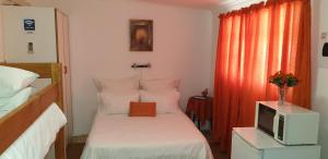 Postel nebo postele na pokoji v ubytování Stemar Self Catering