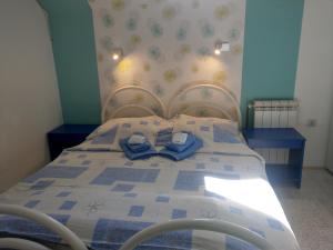 Postel nebo postele na pokoji v ubytování Apartment Harmonija apatin