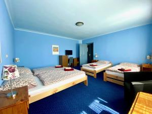 Postel nebo postele na pokoji v ubytování Hotel Rustikal