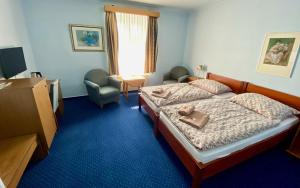 Postel nebo postele na pokoji v ubytování Hotel Rustikal