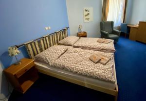 Postel nebo postele na pokoji v ubytování Hotel Rustikal