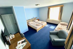 Postel nebo postele na pokoji v ubytování Hotel Rustikal