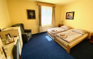 Postel nebo postele na pokoji v ubytování Hotel Rustikal
