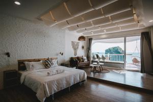 Katil atau katil-katil dalam bilik di Yellow's Kenting B&B II