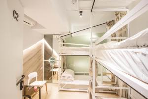 Postel nebo postele na pokoji v ubytování Light Inn