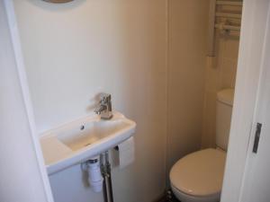 a bathroom with a sink and a toilet at White Horse Studio in Preston