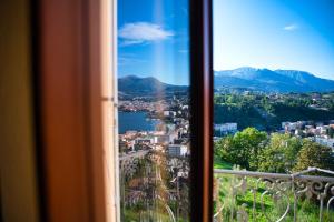 a view of a city from a window at Bigatt Hotel & Restaurant in Lugano