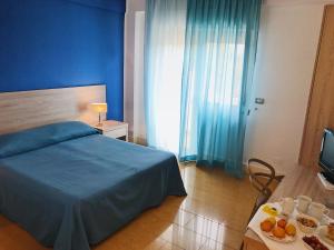 Postel nebo postele na pokoji v ubytování Hotel Conchiglia d'Oro