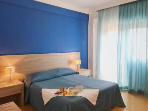 Postel nebo postele na pokoji v ubytování Hotel Conchiglia d'Oro