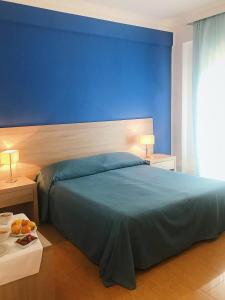 Postel nebo postele na pokoji v ubytování Hotel Conchiglia d'Oro