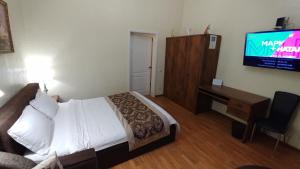 Televízia a/alebo spoločenská miestnosť v ubytovaní One bedroom 3,4 Mala Zhytomyrska