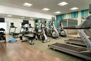 a gym with treadmills and elliptical machines at Holiday Inn Express - Alliance, an IHG Hotel in Alliance