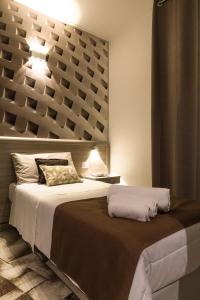 La Piazzetta Guest House tesisinde bir odada yatak veya yataklar