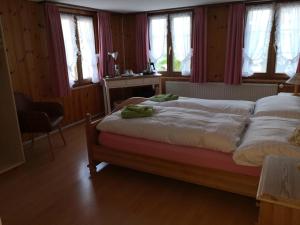 Postel nebo postele na pokoji v ubytování Pizzeria-Pension Gambrinus