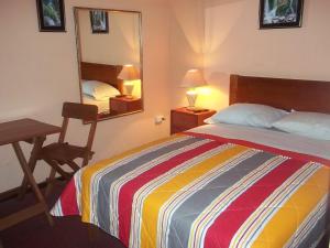 Ένα ή περισσότερα κρεβάτια σε δωμάτιο στο Hotel Excalibur