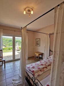 a bedroom with a bed with a canopy at Weingut Amlinger&Sohn in Neef