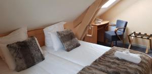 Postel nebo postele na pokoji v ubytování Hôtel Terminus