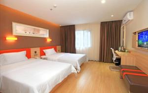 Lova arba lovos apgyvendinimo įstaigoje 7 Days Premium Dalian Zhuanghe Huanghai Avenue