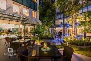 a rendering of the outdoor patio of a building at Rattanachol Hotel in Chon Buri