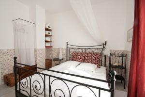 Postel nebo postele na pokoji v ubytování Pavi apartments Vila Amalia