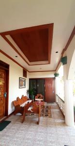 a living room with a couch and a tv on the ceiling at Brazaville Beach Resort in Hinoba-an