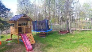 a playground with a play set and a slide at Roubenka Háj in Jindřichovice