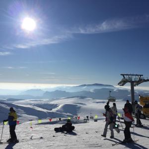 a group of people standing at the top of a ski slope at Pensiunea Nick in Sinaia +14 photos