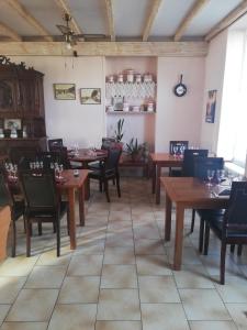 a dining room with wooden tables and chairs at Le Terminus in Pont-dʼAisy +29 photos