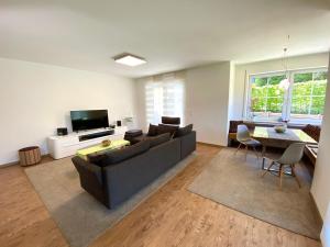 a living room with a couch and a table at Ferienwohnung Winklmoos in Schönau am Königssee