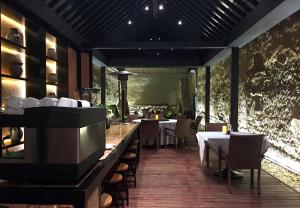 a dining room with tables and chairs in a restaurant at Dali Sky Valley Heritage Boutique Hotel in Dali