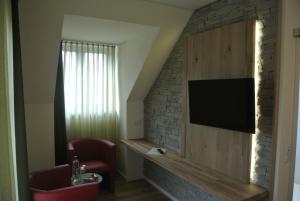 TV a/nebo společenská místnost v ubytování Hotel Jägerhof