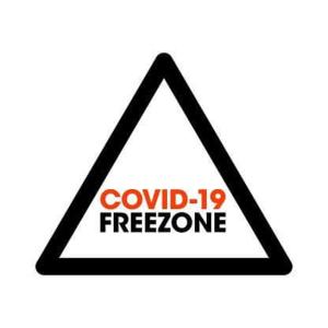 a triangle sign with the words covid free zone at Casa Rural Lagun Etxea in Pobes