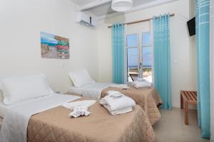 Postel nebo postele na pokoji v ubytování Punda Villas Paros
