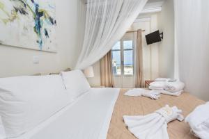 Postel nebo postele na pokoji v ubytování Punda Villas Paros