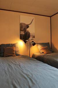 Postel nebo postele na pokoji v ubytování Veluwehuisje Speulderbos