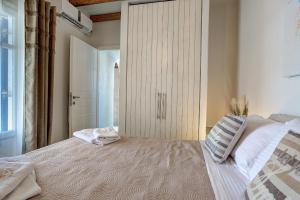Postel nebo postele na pokoji v ubytování Punda Villas Paros