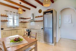 Kuchyň nebo kuchyňský kout v ubytování Punda Villas Paros