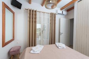 Postel nebo postele na pokoji v ubytování Punda Villas Paros