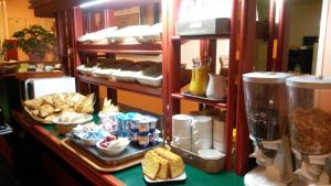 a bakery with a counter with food on it at Quick Palace Vannes in Vannes