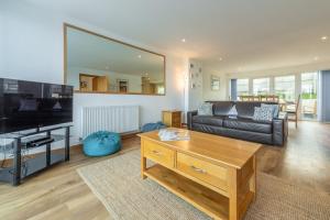 a living room with a couch and a coffee table at Headland Beaches in Newquay