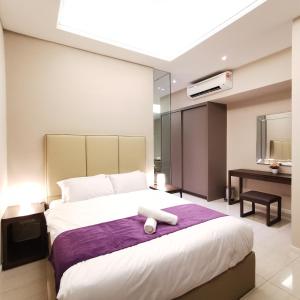 Ліжко або ліжка в номері Dorsett Residences Kuala Lumpur
